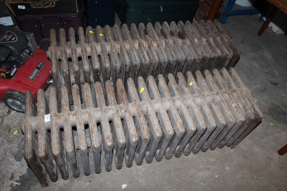 TWO EDWARDIAN FREE STANDING CAST IRON SHAPED / BAY WINDOW RADIATORS