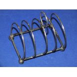 AN ANTIQUE HALLMARKED SILVER TOAST RACK