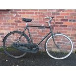 A VINTAGE 1950S RALEIGH THREE SPEED BICYCLE WITH A 23" FRAME AND 26 X 1 3/8" TYRES