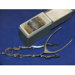 A HALLMARKED SILVER WISH BONE SUGAR TONGS, H.M. SILVER NAPKIN RINGS AND WHITE METAL TONGS