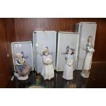 A COLLECTION OF FOUR LLADRO FIGURES, comprising 'New Shoes' 6487, 'Girl With Cake' 5429, Girl With