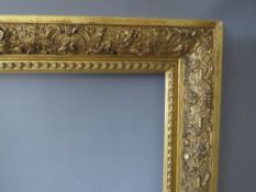 A 19TH CENTURY DECORATIVE GOLD FRAME, frame W 8 cm, rebate 56.5 x 44 cm