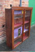 AN EDWARDIAN MAHOGANY GLAZED BOOKCASE WITH 'ROLLS ROYCE' AND 'BENTLEY' STICKERS, H 147 cm, W 119 cm,