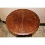 A NINETEENTH CENTURY CARVED PEDESTAL TABLE, on ceramic bun feet, Dia.. 61 cm, H 72 cm