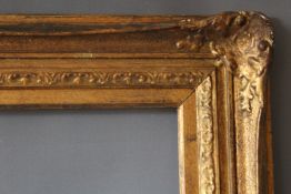 AN EARLY 20TH CENTURY GOLD SWEPT FRAME, with gold slip, frame W 8 cm, slip rebate 88 x 66 cm,