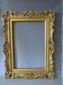 A 19TH CENTURY CARVED WOODEN GILT SWEPT AND PIERCED FRAME, with integral slip, frame W 7.5 cm,