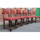 A SET OF SIX OAK FRAMED UPHOLSTERED DINING CHAIRS, circa 1920s, two carvers and four chairs