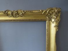 A 19TH CENTURY GILT SWEPT FRAME, frame W 7 cm, inner rebate 49 x 36 cm, outer rebate 54 x 41.5 cm