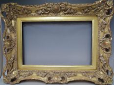 A 19TH CENTURY PIERCED AND SWEPT GOLD FRAME WITH GOLD SLIP, frame W 8 cm, slip rebate 314 x 48.5 cm,