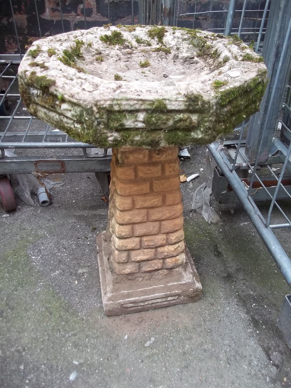 A CONCRETE BIRD BATH