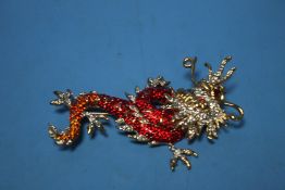 A BOXED "BUTLER & WILSON" DRAGON BROOCH