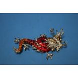 A BOXED "BUTLER & WILSON" DRAGON BROOCH