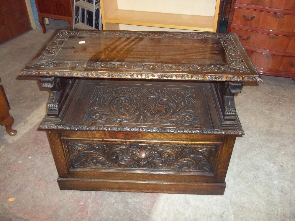 A SOLID OAK ANTIQUE MONKS BENCH