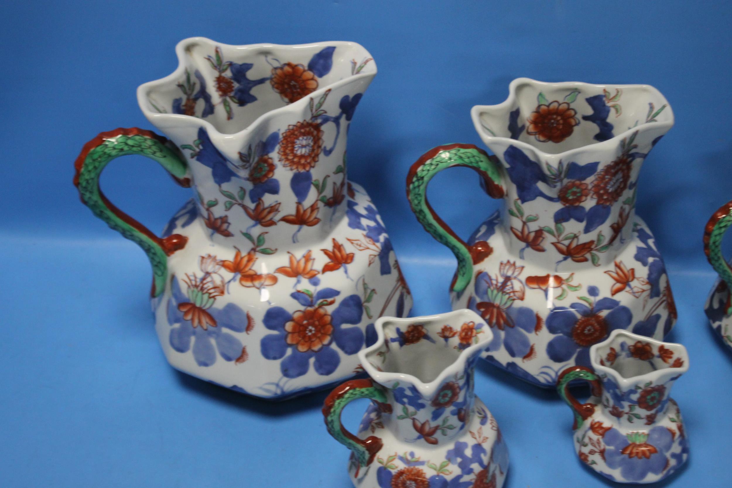 A GRADUATED SET OF FIVE IRONSTONE JUGS - Image 2 of 2