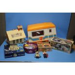 A FISHER PRICE PLAY FAMILY SCHOOL with some figures and accessories together with a Sindy caravan