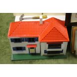 A SMALL WOODEN DOLLS HOUSE WITH A PLASTIC ROOF H 45CM