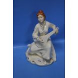 A ROYAL DOULTON FIGURINE "ENCHANTMENT"