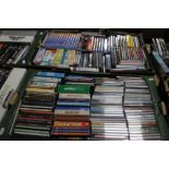 TWO TRAYS OF CDS AND DVDS TO INCLUDE LITTLE HOUSE ON THE PRAIRIE, LETHAL WEAPON, ETC.
