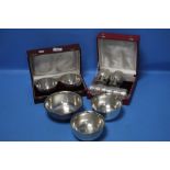THREE INDIAN WHITE METAL BOWLS MARKED "BHATTER", A BOXED PAIR OF BOWLS AND A BOXED SET CONSISTING OF