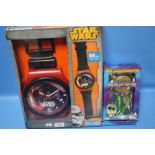 A BOXED STAR WARS WALLCLOCK AND A THUNDERBIRDS DVD AND TOY GIFT SET A/F