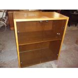 AN OAK TYPE SMOKED GLASS STORAGE DISPLAY CUPBOARD