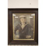 A FRAMED WWI PORTRAIT PHOTOGRAPH OF A ROYAL NAVY SAILOR IN UNIFORM HIS CAP READING HMS TIPPERARY