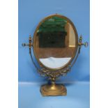 A BRASS DRESSING TABLE MIRROR