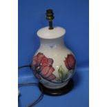 A MOORCROFT HIBISCUS PATTERN LAMP BASE