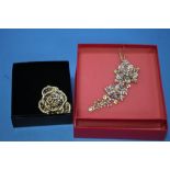 TWO BOXED "BUTLER & WILSON" FLOWER BROOCHES (2)