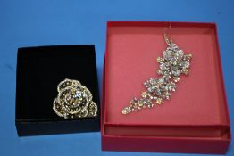 TWO BOXED "BUTLER & WILSON" FLOWER BROOCHES (2)
