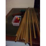 A SELECTION OF SNOOKER CUES AND BALLS