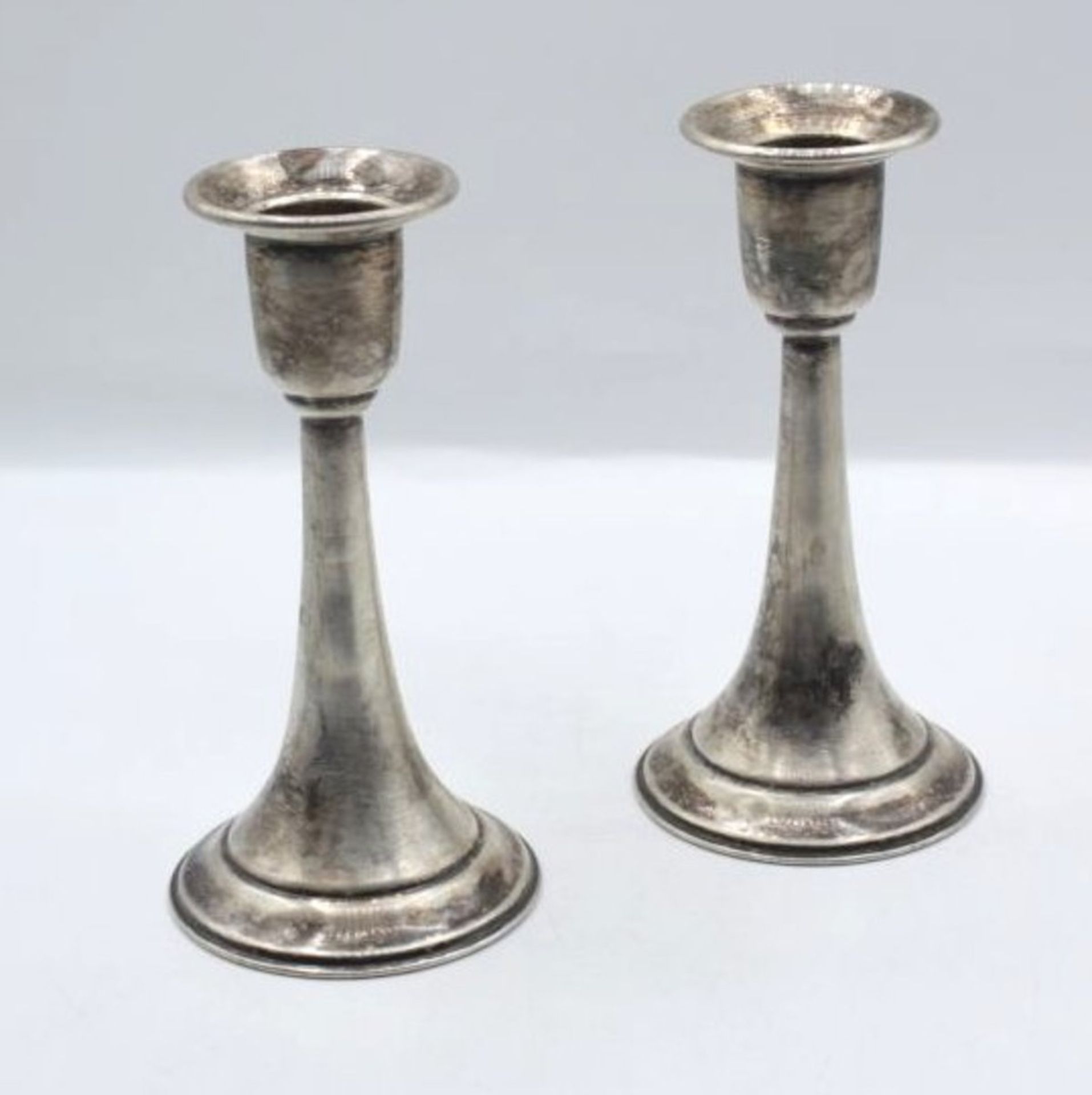 Leuchterpaar, Silber gepr., gefüllter Stand, zus. 252,6gr., H-13cm.