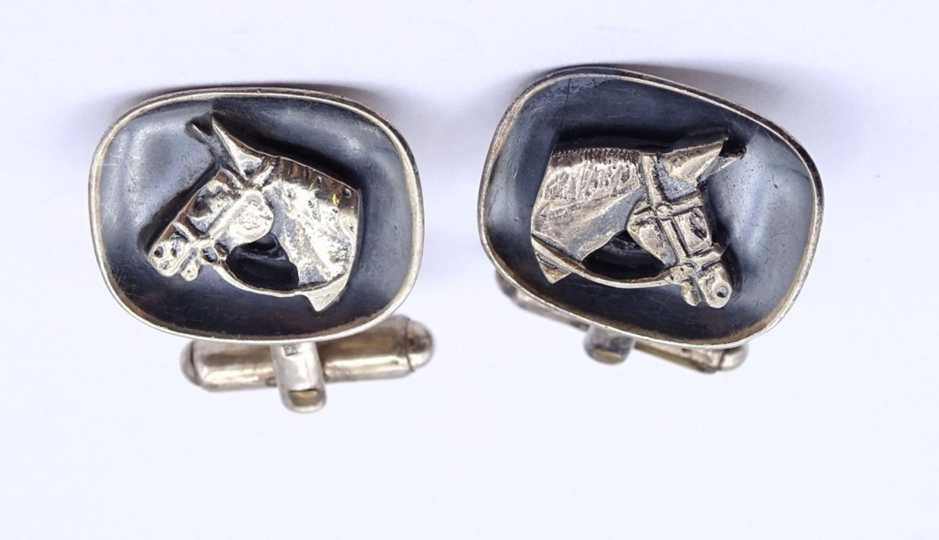 Paar Manschettenknöpfe,Silber 0.835 mit Pferdeköpfen,zus.12,7gr., Kopf 20,5x17,0mm