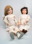 Zwei Puppen, Frankreich, 1. Hälfte 20. Jhd.,im Nacken gemarkt "Depose Fabrication francaise