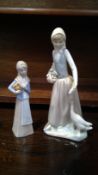 A NAO porcelain figurine of a maiden with a goose and another porcelain figurine.