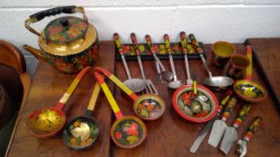 Russian papier mache lacquered kitchen utensils, and a similarly decorated aluminum kettle, etc.