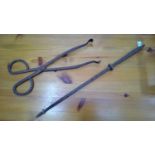 Vintage fire poker and tongs.