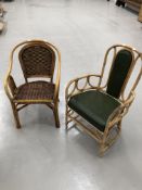 A cane and wicker armchair with leather seat and back, and another ane and wicker armchair.