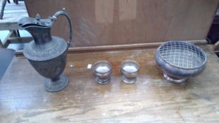 A collection of silver-plated items. A pair of goblets, a potpourri dish, and a claret jug.