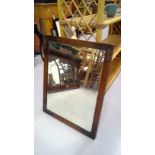 Mahogany wall hanging mirror with a beveled edge. Height 68cm width 52.5cm