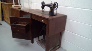 Singer sewing machine and table, cast iron frame