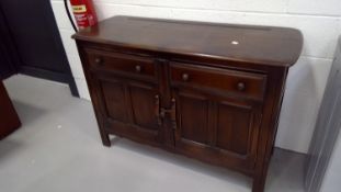 An Ercol Old Colonial sideboard or low dresser height 84.5cm width 124cm depth 45.5cm