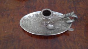 A silver-plated candlestick holder and other items including a decorated copper plate, a mix of