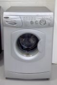 A Hotpoint Aquarius washing machine height 85.5cm width 59cm depth 55cm