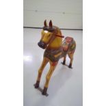 Wood carved and painted model of a horse, height 97cm width 84cm depth 30cm.