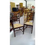 A pair of Ercol Old Colonial ladder back chairs.