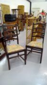 A pair of Ercol Old Colonial ladder back chairs.