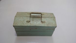 Metal toolbox containing tools and parts.