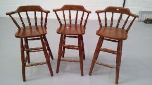 Three bow back bar stools, height 106cm seat height 78.5cm.