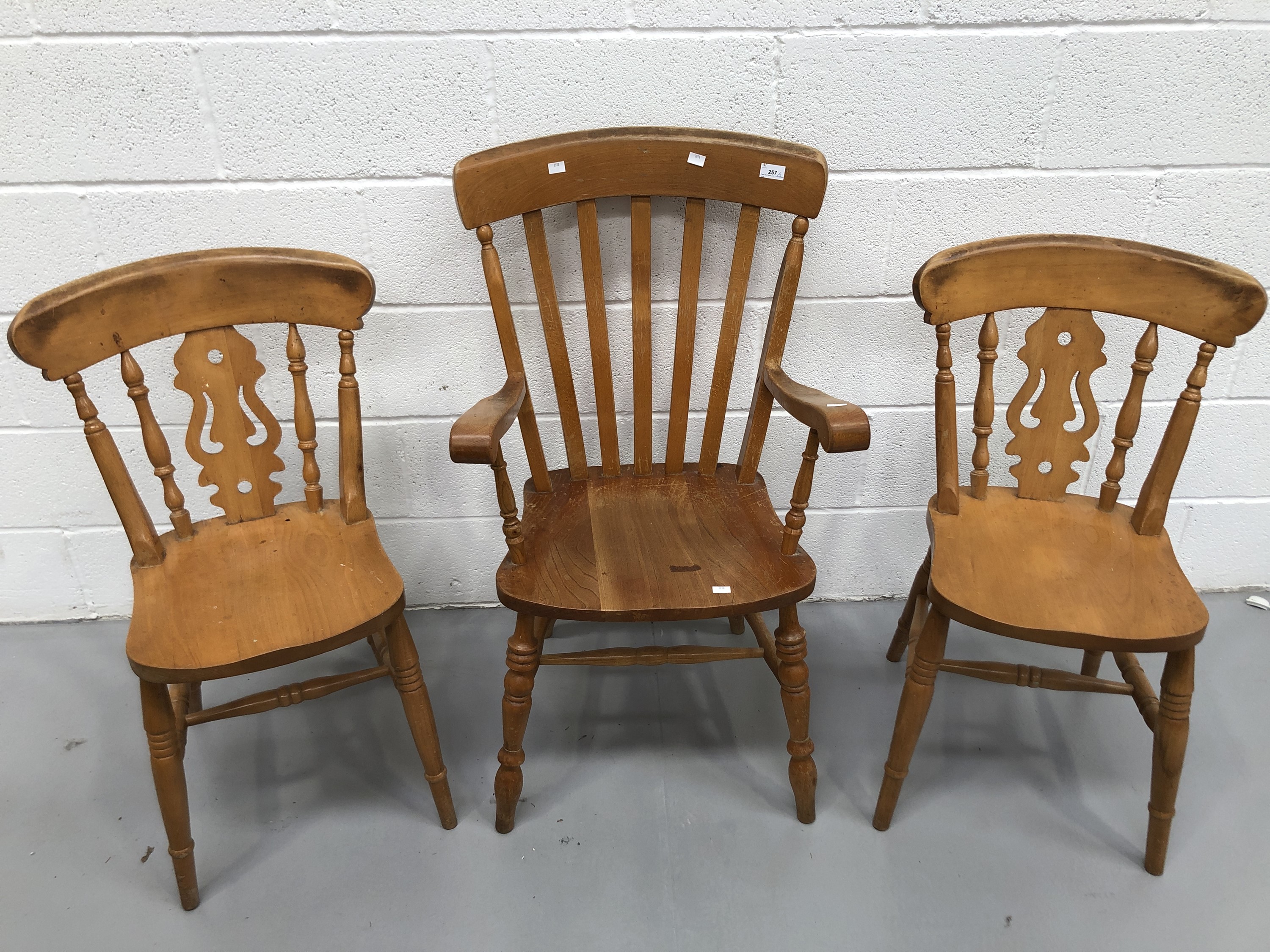 Windsor lathe back armchair, and a pair of pine stick back chairs